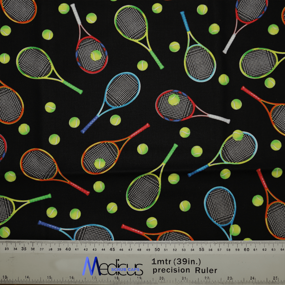 Discover the Tennis Racket Scrub Cap by Medicus Scrub Caps, featuring a black fabric adorned with colorful tennis racket and ball patterns. Perfectly scaled in inches and centimeters, its the ideal uniform accessory with an inclusive fit for all.