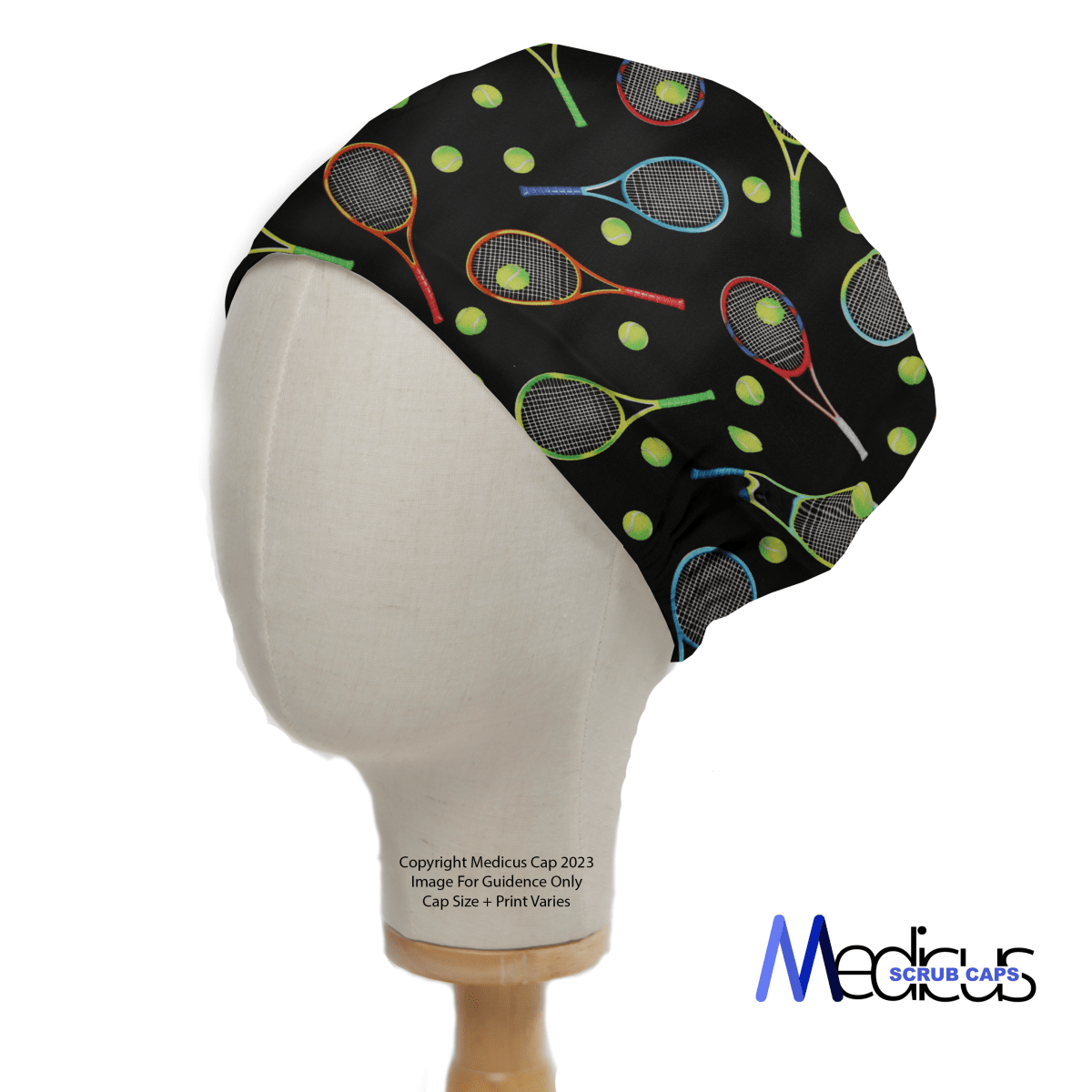 A mannequin head sports a Tennis Racket Scrub Cap by Medicus Scrub Caps. This colorful black cap features tennis rackets and balls, offers an inclusive fit, and displays the brand logo in the lower right corner—a vibrant addition to any healthcare uniform.