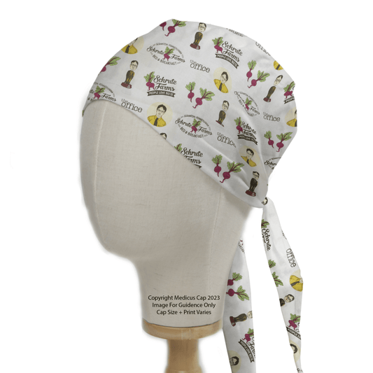 A mannequin head displays the Medicus Scrub Caps The Office Schrute Farms Scrub Cap, adorned with cartoon characters and beets along with Schrute Farms text. It ties at the back, set against a white backdrop, offering an eco-friendly choice for medical professionals.