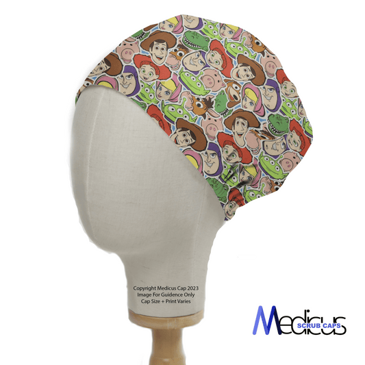 A mannequin head displays the Medicus Scrub Caps Toy Story Faces Cutout scrub cap, featuring colorful cartoon characters and space-themed cows. The vibrant design adds a playful touch, ideal for healthcare professionals, with the brand logo subtly shown in the corner.