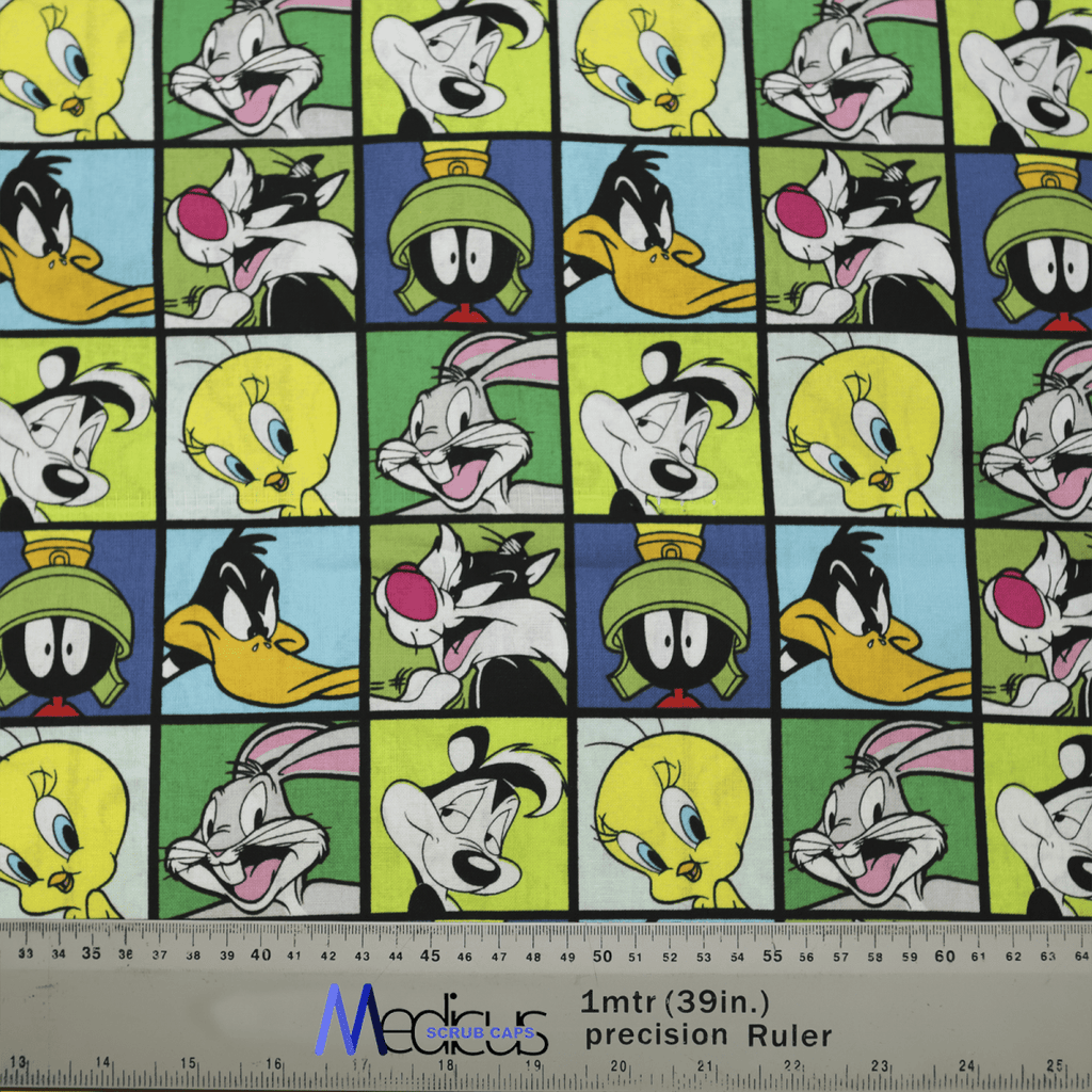 The Medicus Scrub Caps TV Cartoon Looney Tunes Characters Grid Green Scrub Cap features a colorful grid of Bugs Bunny, Daffy Duck, and Tweety Bird against vibrant backgrounds. An eco-friendly 39-inch ruler adds a unique touch, perfect for personalizing your scrub cap collection!.