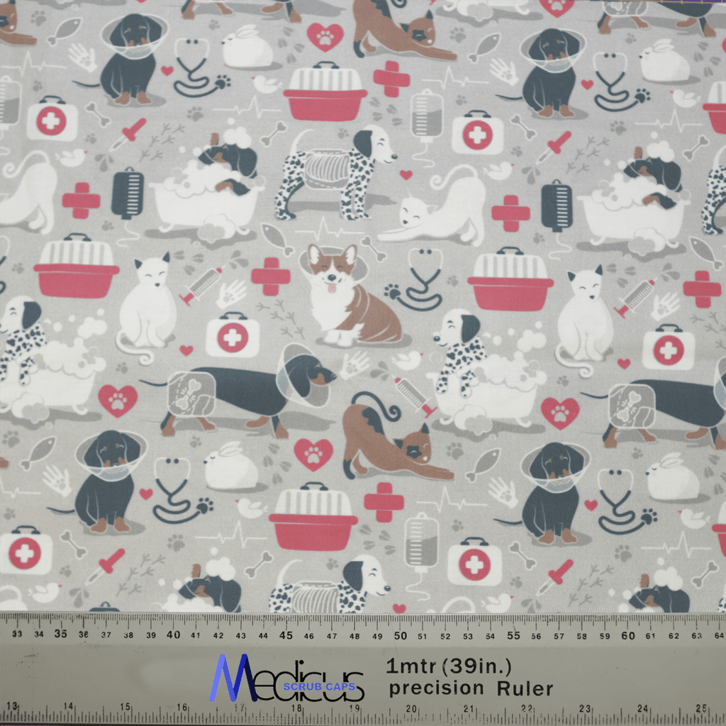 The Vet Clinic Surgery Scrub Cap by Medicus Scrub Caps is designed for veterinary professionals, featuring cartoon animals (dogs and cats) with stethoscopes, bones, bandages, and red crosses. It comes in gray, white, brown, and pink with a bottom ruler for precise personalization.