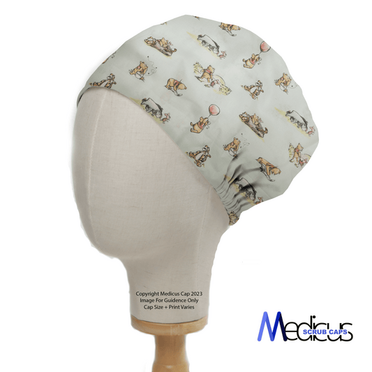 A mannequin displays the Winnie The Pooh #2 Green Scrub Cap by Medicus Scrub Caps, adorned with various playful dogs on a light green background, ideal for healthcare professionals.