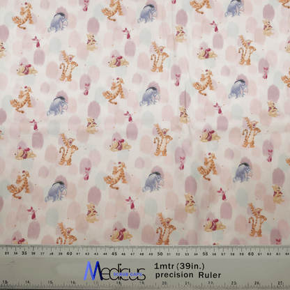The Medicus Scrub Caps Winnie The Pooh + Friends Finger Paint features a playful pattern with cartoon tigers, elephants, and bears on white, adorned with pink polka dots. A ruler is at the bottom edge for scale.