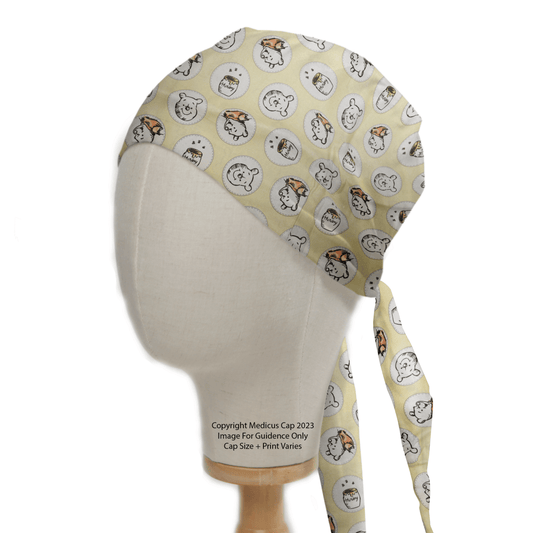 The Medicus Scrub Caps Winnie the Pooh Honey Pots scrub cap, with cartoon dog faces on light yellow fabric and long ties cascading down one side, adds a whimsical touch to clinical attire. The mannequin head display against a white background suits healthcare professionals perfectly.