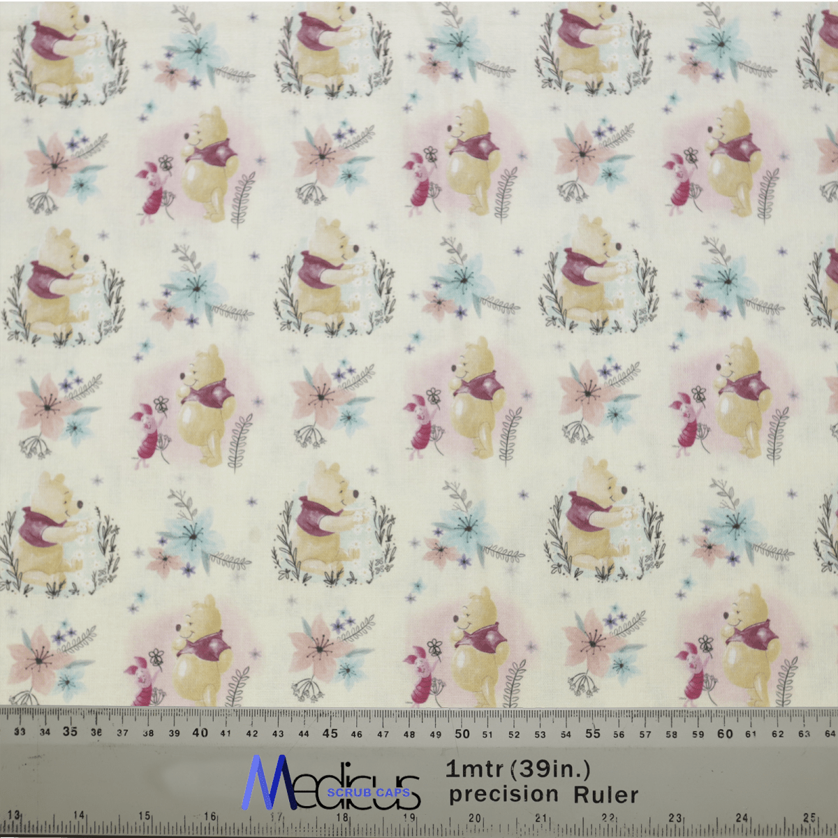 Woodland-themed fabric adorned with bears, foxes, and rabbits amidst colorful flowers on a light backdrop is ideal for crafting the Winnie The Pooh + Piglet Scrub Cap by Medicus Scrub Caps. Includes a ruler for measurements in meters and inches.