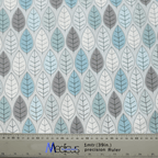 Medicus Scrub Caps Winter Leaves Scrub Cap features a calming leaf pattern in blue, gray, and white. The leaves are arranged in alternating rows, and a metal ruler at the bottom provides measurements in both meters and inches.