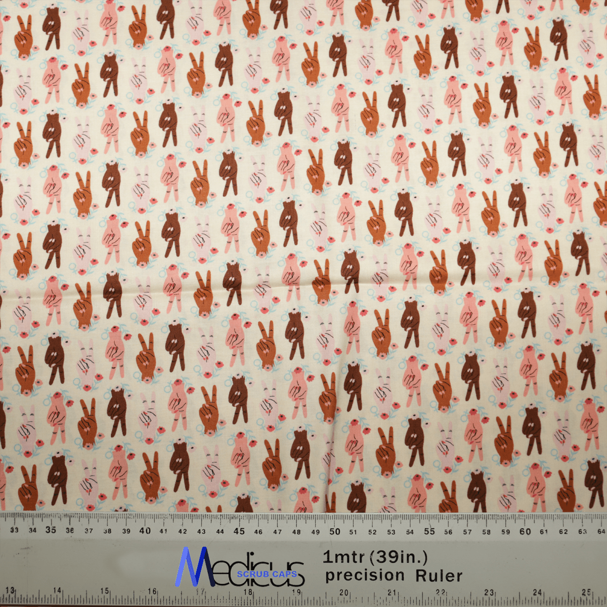 Medicus Scrub Caps offers the Women Peace Sign Empowerment Scrub Cap, featuring a repeated pattern of brown, pink, and white standing rabbits with spots or hearts in various poses. Ideal for healthcare professionals, it includes a measuring ruler at the bottom to show scale.